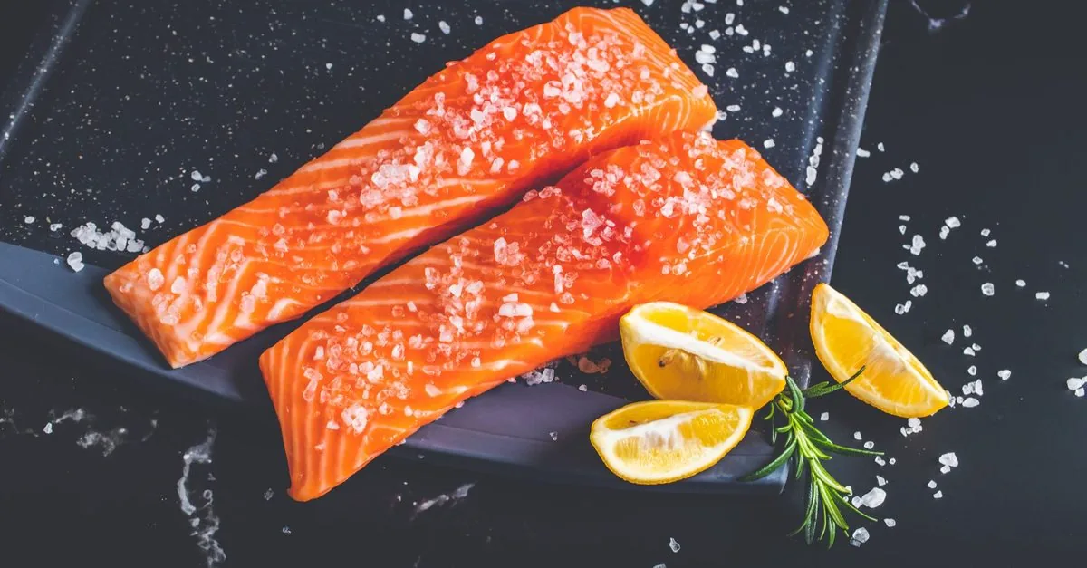 Raw salmon fillets with lemon