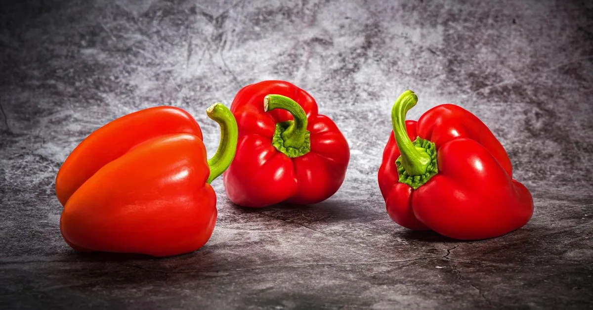 Three red bell peppers