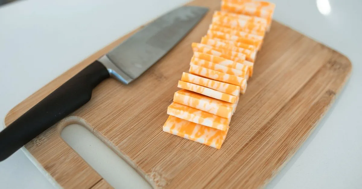 Slices of cheese on a wooden board