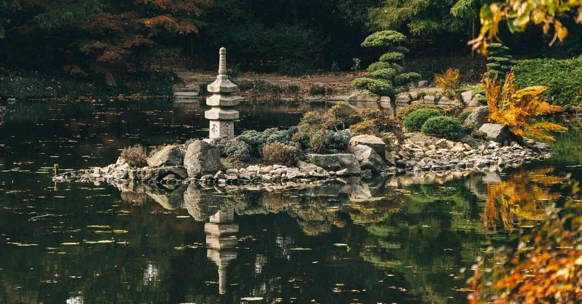 A stone lantern on a small island in the pond of the Japanese Garden in Park Szczytnicki, Wrocław